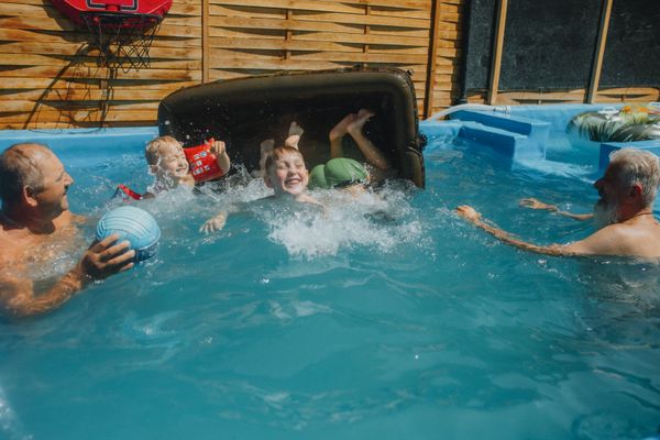 Children playing in an above-ground pool
