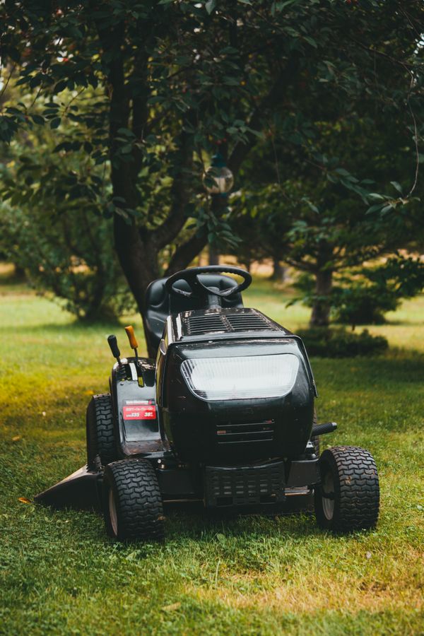 A ride-on lawnmower on a lawn
